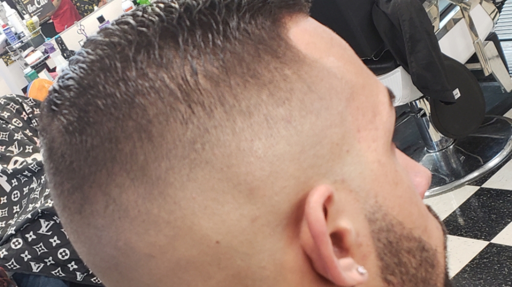 A finished skin fade and clean neckline done at Jon'h Star Barber Cuts